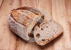 Rustic bread on an wooden table. Country house style. Authentically