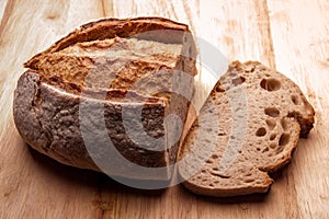 Rustic bread on an wooden table. Country house style. Authentically