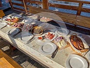 Rustic breakfast at the campsite for several tourists