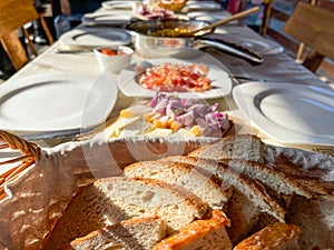 Rustic breakfast at the campsite for several tourists