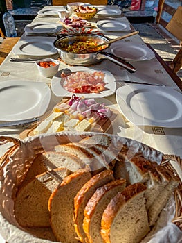 Rustic breakfast at the campsite for several tourists