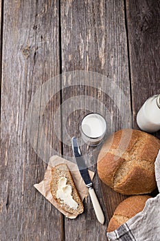 Rustic breakfast with wholegrain bread, milk and butter