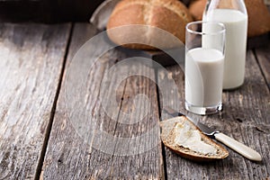 Rustic breakfast with wholegrain bread, milk and butter