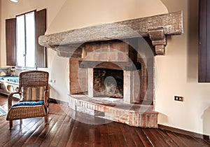 Rustic brick fireplace with wooden beams