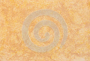 Pattern of rustic brown mediterranean stucco wall background texture