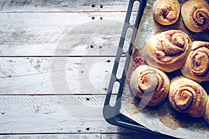 Rustic buns of sweet milk and cinnamon. Gastronomic concept