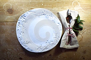 Rustic casual country dinner place setting with hand made plate for Thanksgiving or Christmas