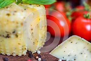 Rustic cheese with herbs, pepper and vegetables