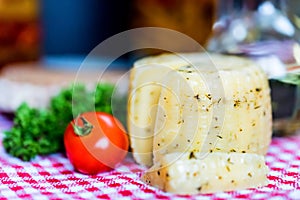 Rustic cheese with herbs and tomatoes