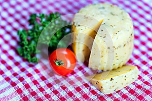 Rustic cheese with herbs and tomatoes