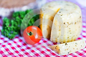 Rustic cheese with herbs and tomatoes