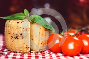 Rustic cheese with herbs and tomatoes