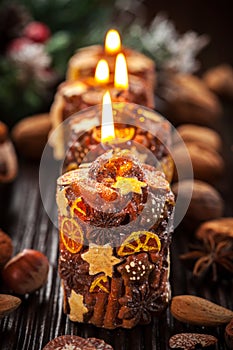 Rustic Christmas candles with spices and nuts