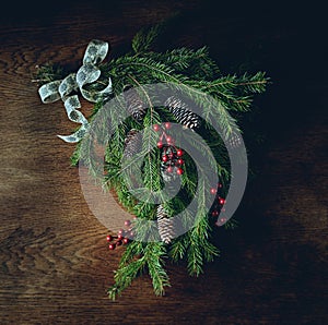 Rustic Christmas decoration made with natural fir twigs and cones