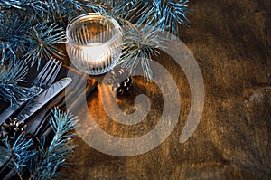 Rustic Christmas table setting with candle.