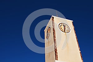 Rustic clock tower in Oia. Santorini, Greece.