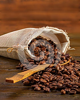 Rustic coffee sack on a dark wood surface.