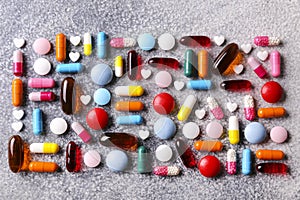 Rustic composition with multiple pills laid out in a pattern