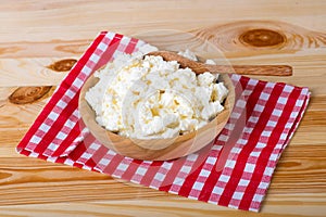 Rustic cottage cheese on a wooden table