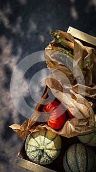 Rustic Crate of Tomatoes, Asparagus, and Rockmelon photo