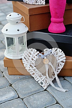 Rustic decor on a white shabby chic chair near the wall