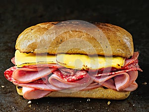 Rustic deli cold cuts sandwich