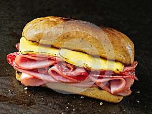 Rustic deli cold cuts sandwich