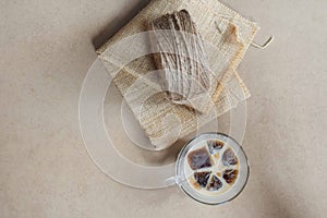 Rustic design with a roll of burlap string and cup of iced coffee