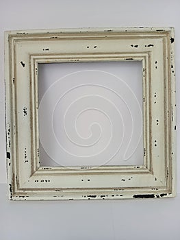 Rustic distressed wood picture frame on a white background