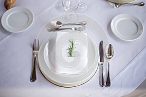 Rustic elegant place setting in white tones.