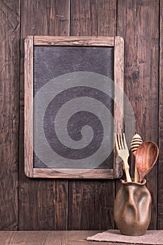 Rustic empty menu blackboard on wooden wall