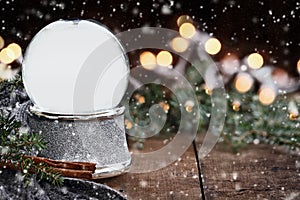 Rustic Empty Silver Snow Globe with Falling Snow photo