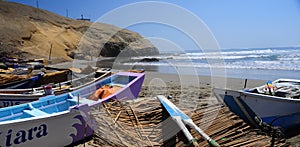 Rustic fishing boast in the coast of Lima Peru }