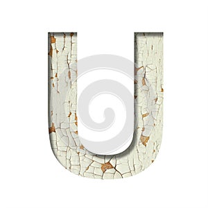 Rustic font. The letter U cut out of paper on the background of old rustic wall with peeling paint and cracks. Set of simple