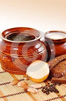 Rustic food, soup in a clay pot