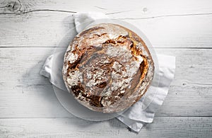 Fresh rustic bread on a wooden table
