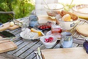 Rustic garden table prepared for an outside meal with the family