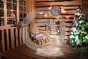 Rustic house in Christmas time. Winter holiday season. Decorated