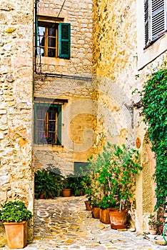 Rustic houses and narrow alley in an old mediterranean village