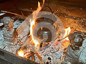 Rustic image of a wood burning fireplace, to cook in the heat of the fire.