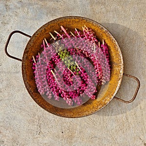 Rustic iron plate with purple plants