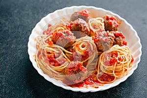 Rustic italian american meatball spaghetti tomato sauce