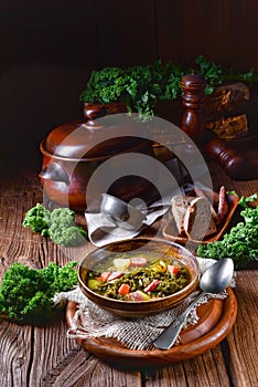 Rustic kale soup with meat and sausage