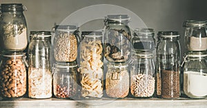 Rustic kitchen food storage arrangement in glass jars