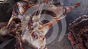 rustic lamb barbecue bbq over open fire in Patagonia