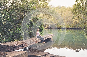 Rustic large hewn timber jetty in Australian bushland