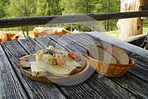 a rustic meal of cheeses and cold cuts in the Austrian Alps of the Schladming-Dachstein region (Styria in Austria)