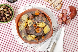 rustic meal of ox tail with potato and carrot