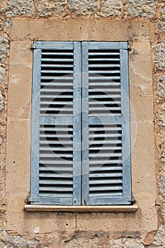 Rustic Mediterranean architecture with blue shutters, Majorca, Spain