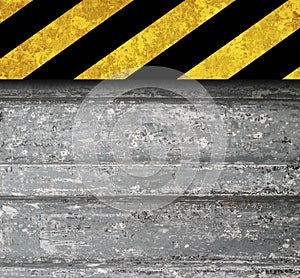 Rustic metal background with warning stripes